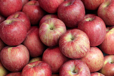 Pile of fresh red apples, the fruit used in Jar Thuraya apple and cinnamon jam