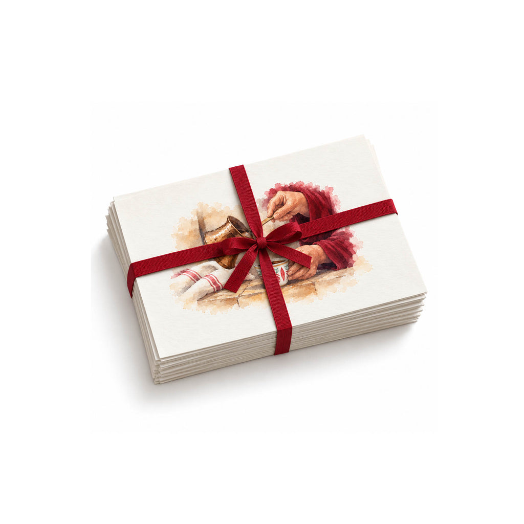 Stack of coffee illustration postcards tied with a burgundy ribbon