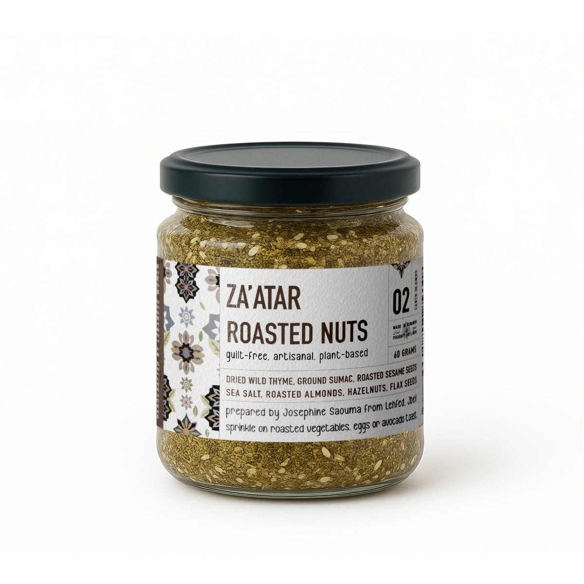 Small jar of Jar Thuraya za'atar with roasted nuts on a white background